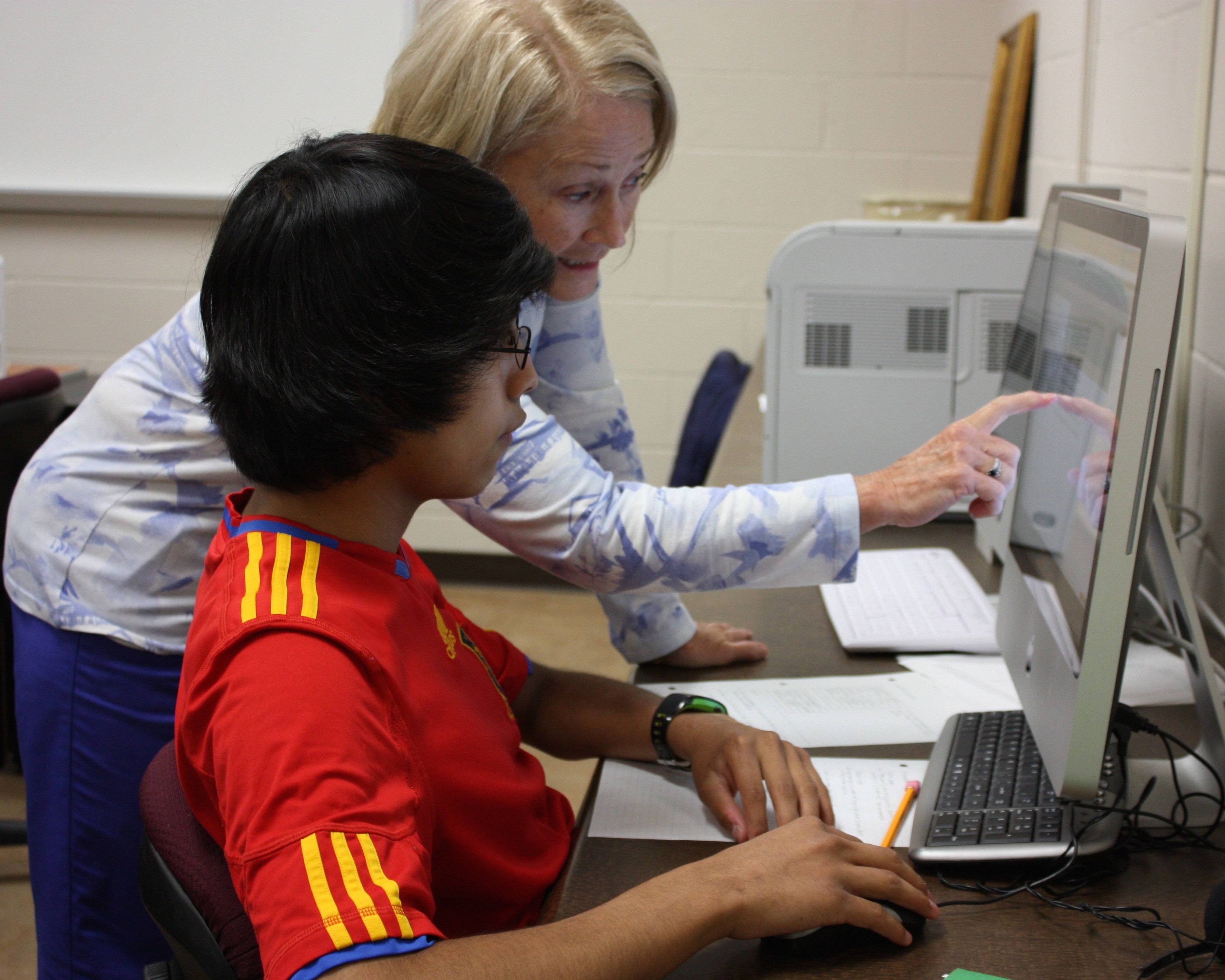 Teacher working with student